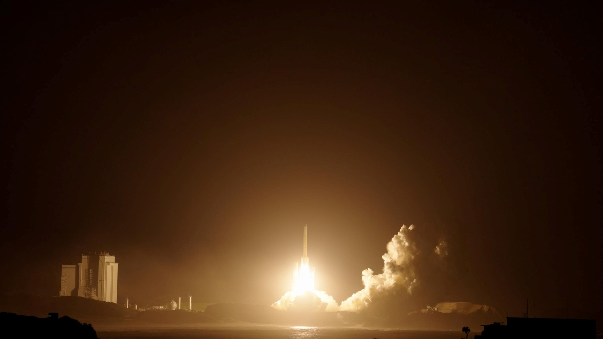 A photo of the H3 rocket launching into space at night on Oct. 19