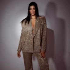 best party outfits - woman wearing sparkly suit from SLA