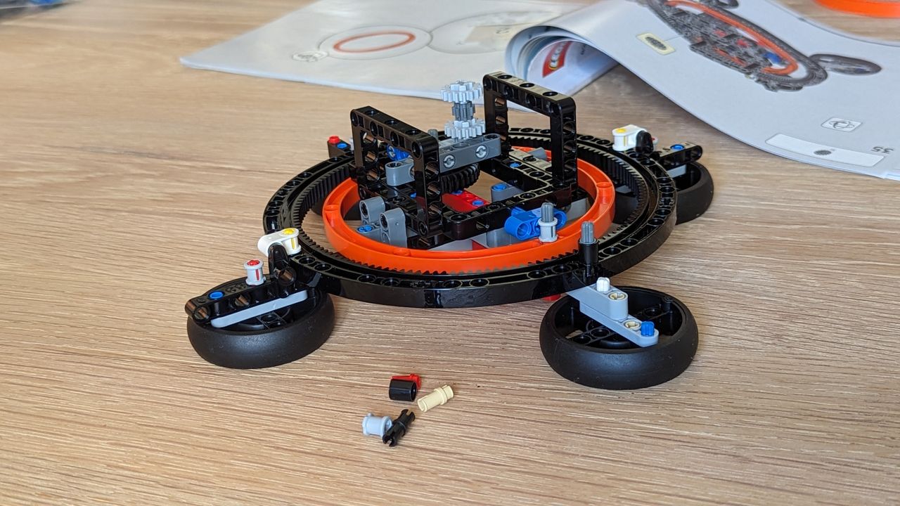 Lego technic planet earth and moon in orbit set on a white background