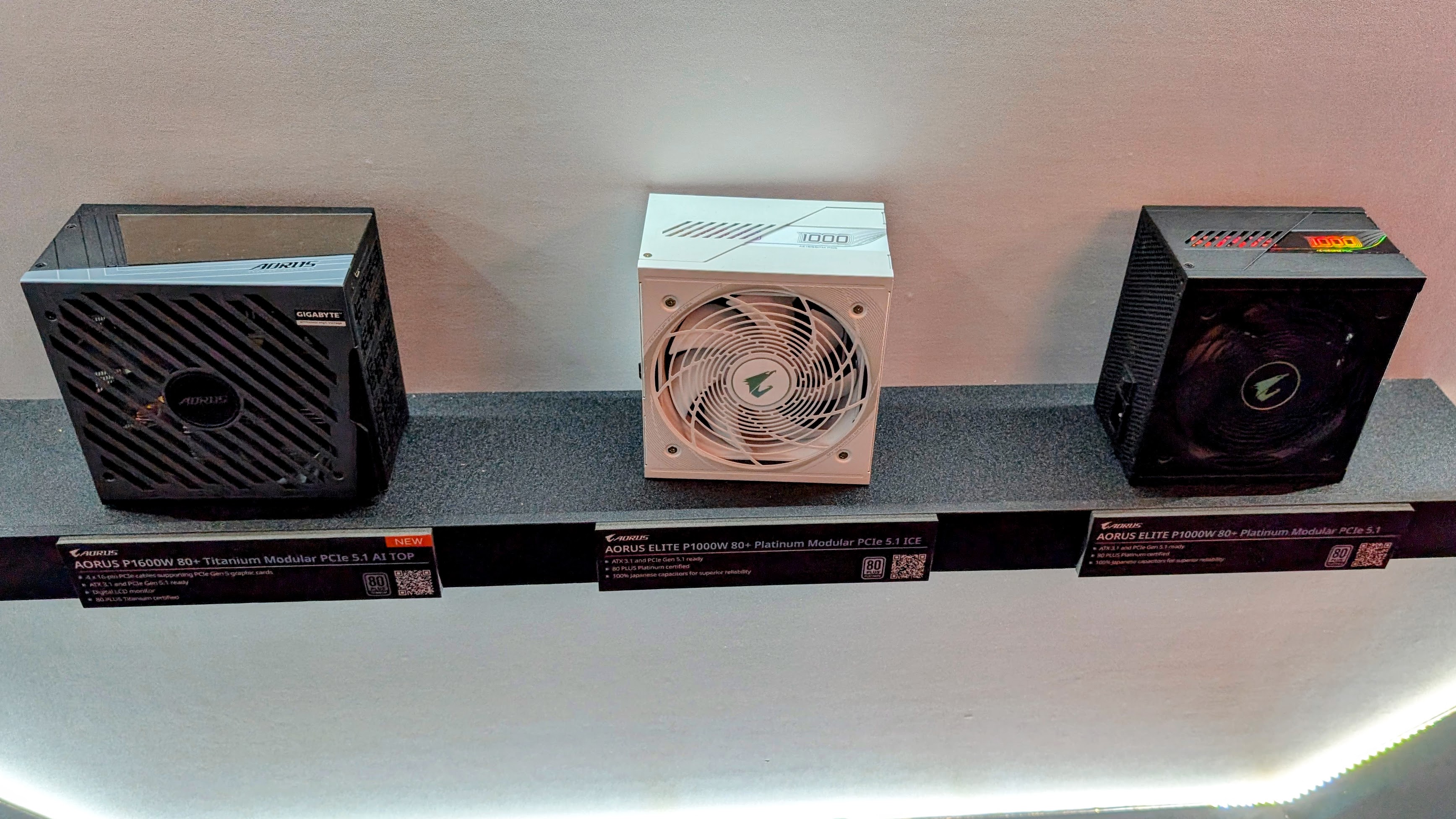 Gigabyte Aorus PSUs on displaying showing the P1600W and Elite P1000W in black and white