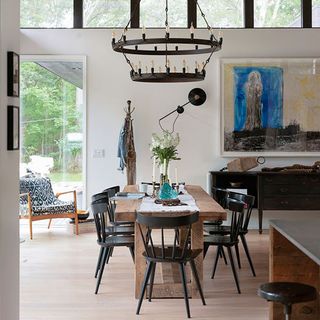 dining room with dining table with chairs and chandelier