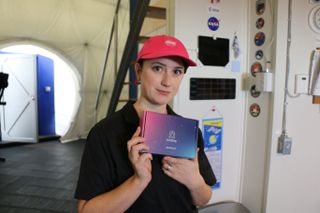 Space.com's Chelsea Gohd holds a LifeShip DNA sample collection kit during an analog Mars mission at the HI-SEAS habitat in November of 2020.
