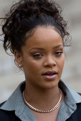 Rihanna pictured with a curly updo as she rrives to meet French President Emmanuel Macron (not pictured) at the Elysee Palace on July 26, 2017 in Paris, France.