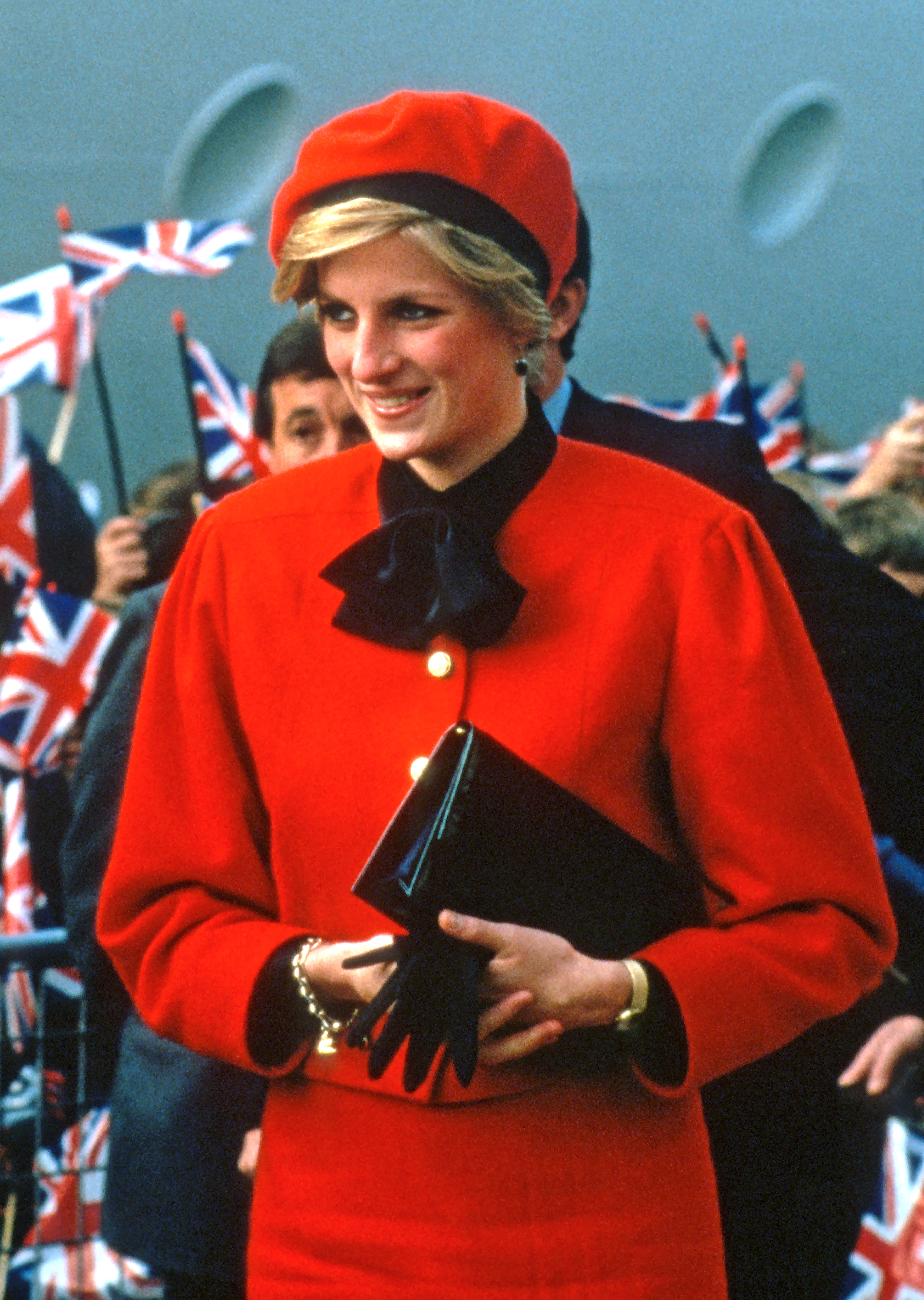 Princess Diana wearing a red jacket and beret