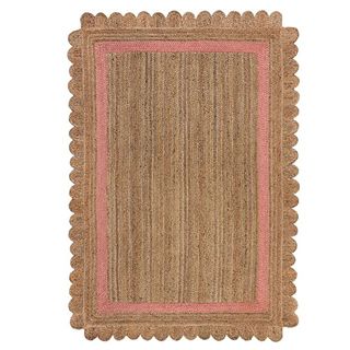 Dunelm jute rug with scalloped edges and pink trim.