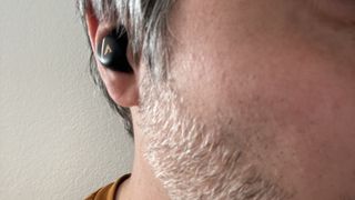 Atlantic Technology TWS1 earbuds in listener's ear
