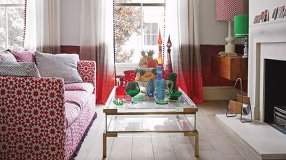 Red and white living room with patterned sofa