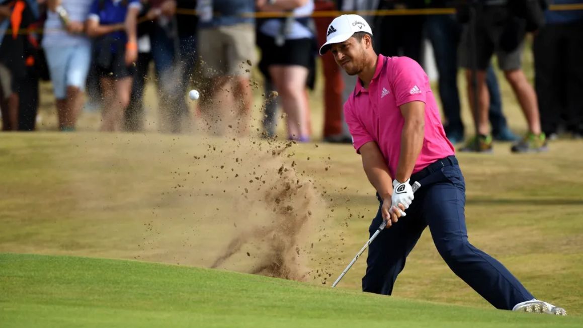 Xander Schauffele plays a bunker shot