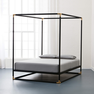 iron canopy bed frame with gold accents