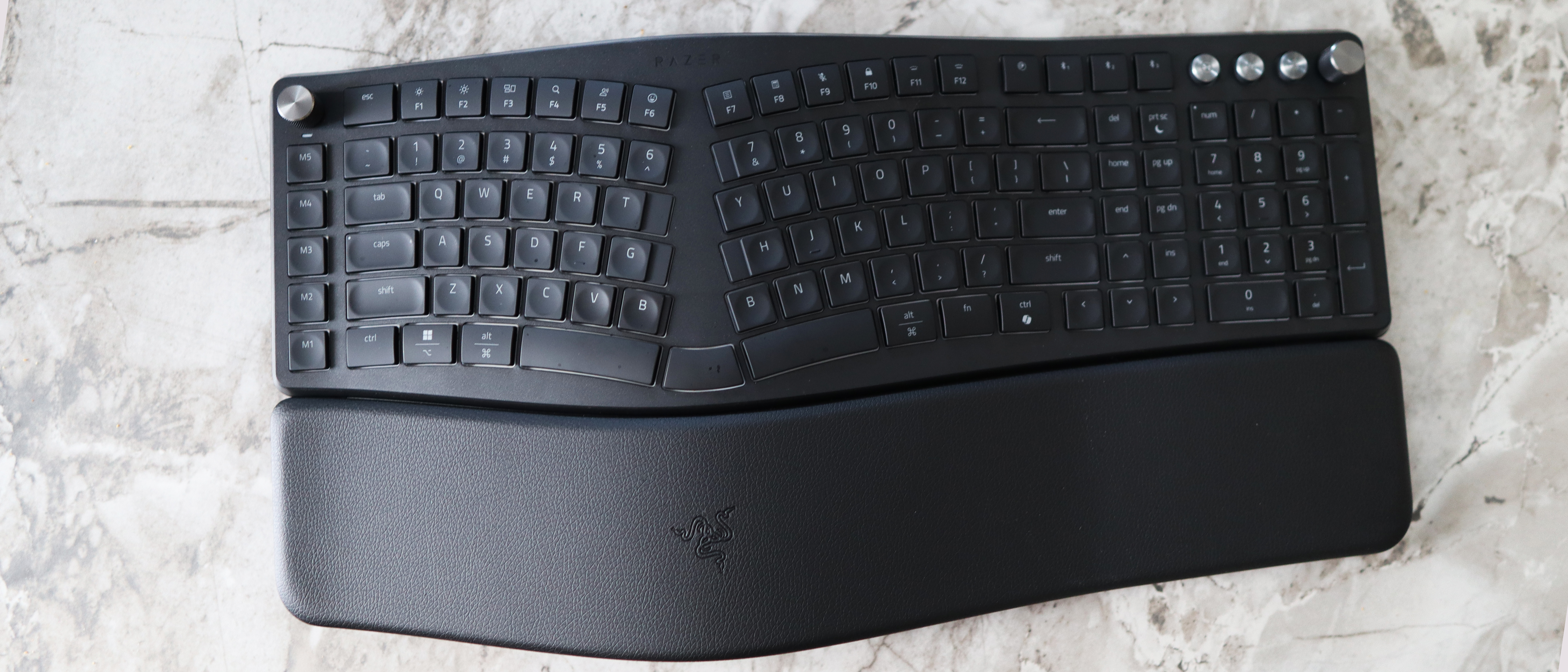 Razer Pro Type Ergo ergonomic keyboard on marble surface