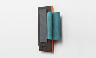 'Linear Thinking' brooch in African blackwood, silver, mild steel, paper brass and low temperature enamel by Hayley Grafflin