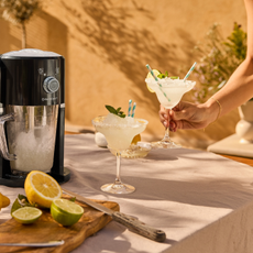Lidl slushy maker next to frozen marg on outdoor table.
