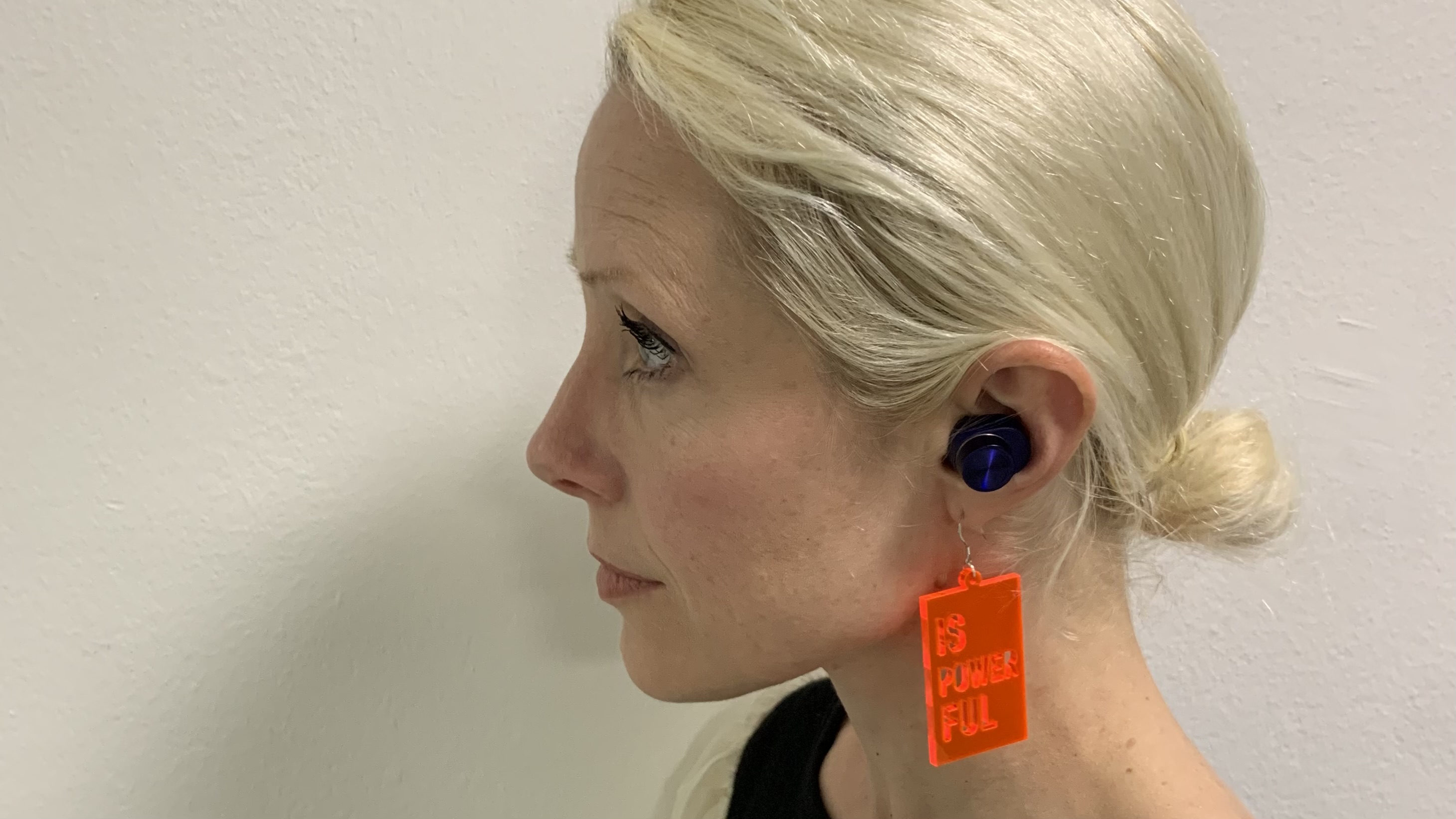 Pi7 S2 earbuds worn by TechRadar's Becky Scarrott, on white background