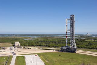 The new Liberty launch vehicle, which draws on parts of NASA's cancelled Ares I rocket and Europe's Ariane 5 rocket, will use existing infrastructure at Kennedy Space Center--including, possibly, the mobile launch platform shown in this illustration.