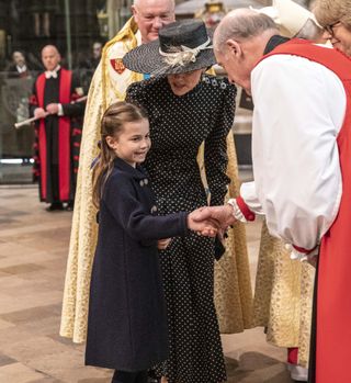 Catherine, Duchess of Cambridge introduces her daughter Princess Charlotte of Cambridge to the Archbishop of Canterbury Justin Welby