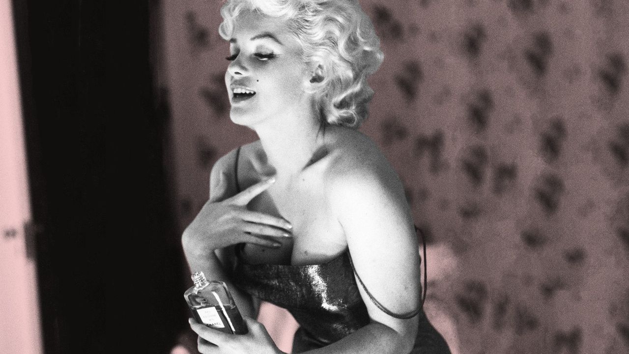 Marilyn Monroe Putting Chanel Perfume On