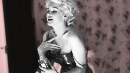 Marilyn Monroe Putting Chanel Perfume On