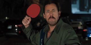 Hubie Halloween Adam Sandler holding a defensive ping pong paddle