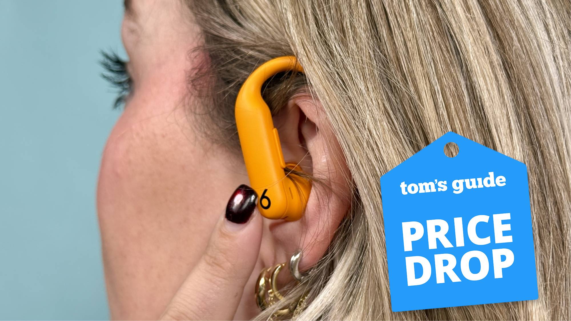 Person wearing Beats Powerbeats Pro 2 earbuds