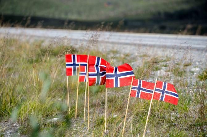 Norwegian flags flutter in the breeze
