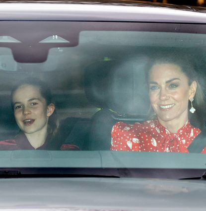 Princess Charlotte and Princess Kate riding in a car with Prince William