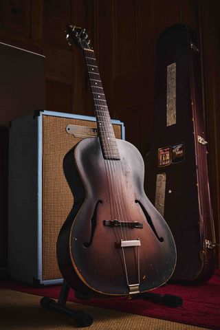 Gibson L-37 archtop acoustic guitar in tobacco sunburst. It has two f-holes and no soundhole.