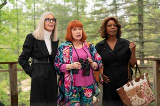 diane keaton, kathy bates, and alfree woodward, standing on a balcony in the woods, in the 2024 comedy movie 'Summer Camp'