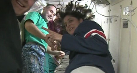 NASA astronaut Sunita Williams bids farewell to the Expedition 33 crew during a ceremony before departing the International Space Station with the homeward bound Expedition 33 crew on Nov. 18, 2012.