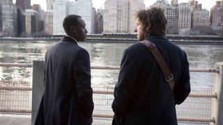 Adam Sandler and Don Cheadle overlooking a river in 'Reign Over Me'