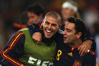 Victor Valdes and Xavi celebrate after Spain's World Cup win in 2010.