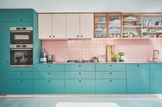 turquoise green kitchen with pink tiles