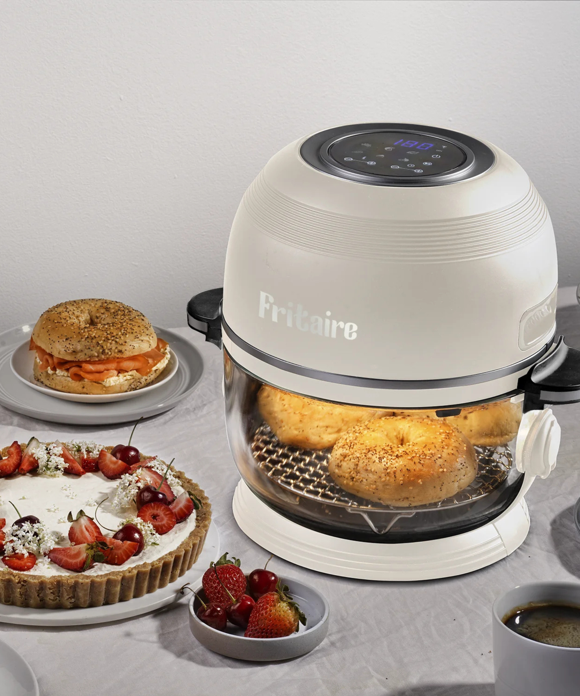 Fritaire Glass Air Fryer in white, baking bagels