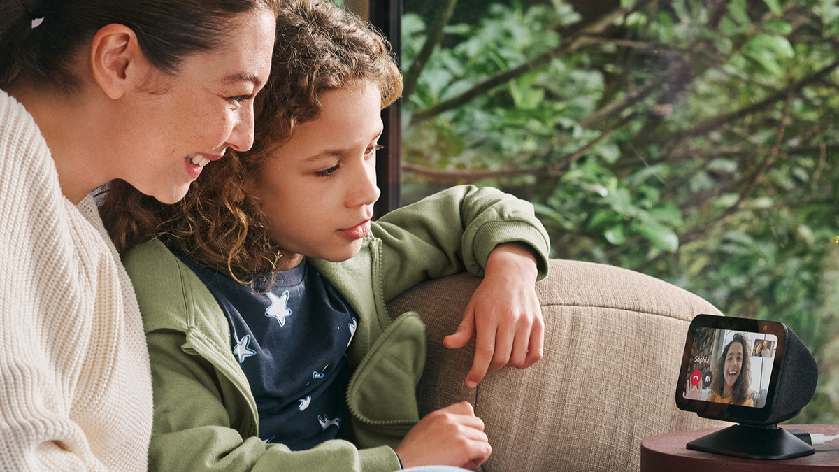 A mother and son making a video call on the Echo Show 5