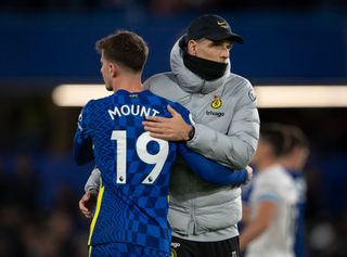 Chelsea manager Thomas Tuchel greets Mason Mount after the Premier League match between Chelsea and Burnley at Stamford Bridge on November 6, 2021 in London, England.