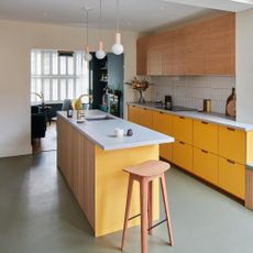yellow kitchen with wood detail