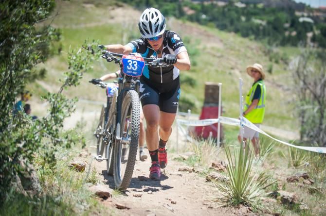Katie Compton (Trek) makes he way up short technical climb during the elite women's cross country race.