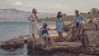 Conversations with Friends cast: Melissa (Jemima Kirke), Bobbi (Sasha Lane), Frances (Alison Oliver) and Nick (Joe Alwyn) resting on the rocks on holiday