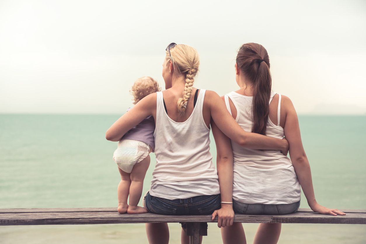 Lesbian parents with child.