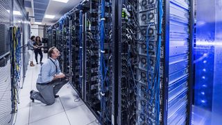 A team of people configuring servers