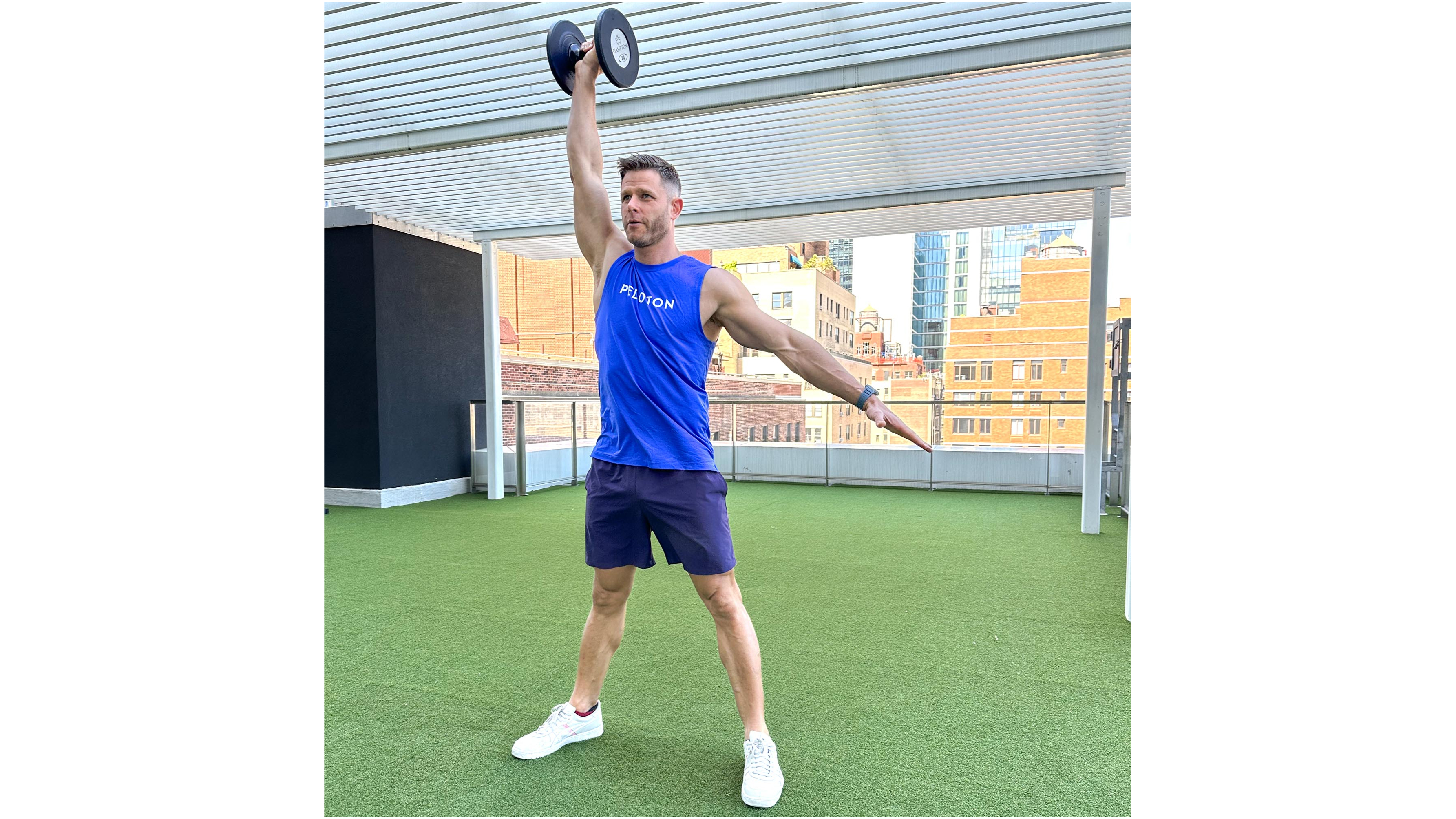 Andy Speer performing a dumbbell snatch
