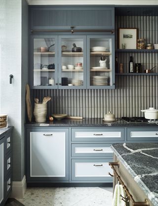 Gray kitchen with fluted glass cabinets
