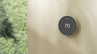 Nest Learning Thermostat (4th Gen) on wall - Silver