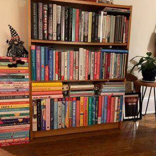 danielle valente's bookshelf in her small apartment