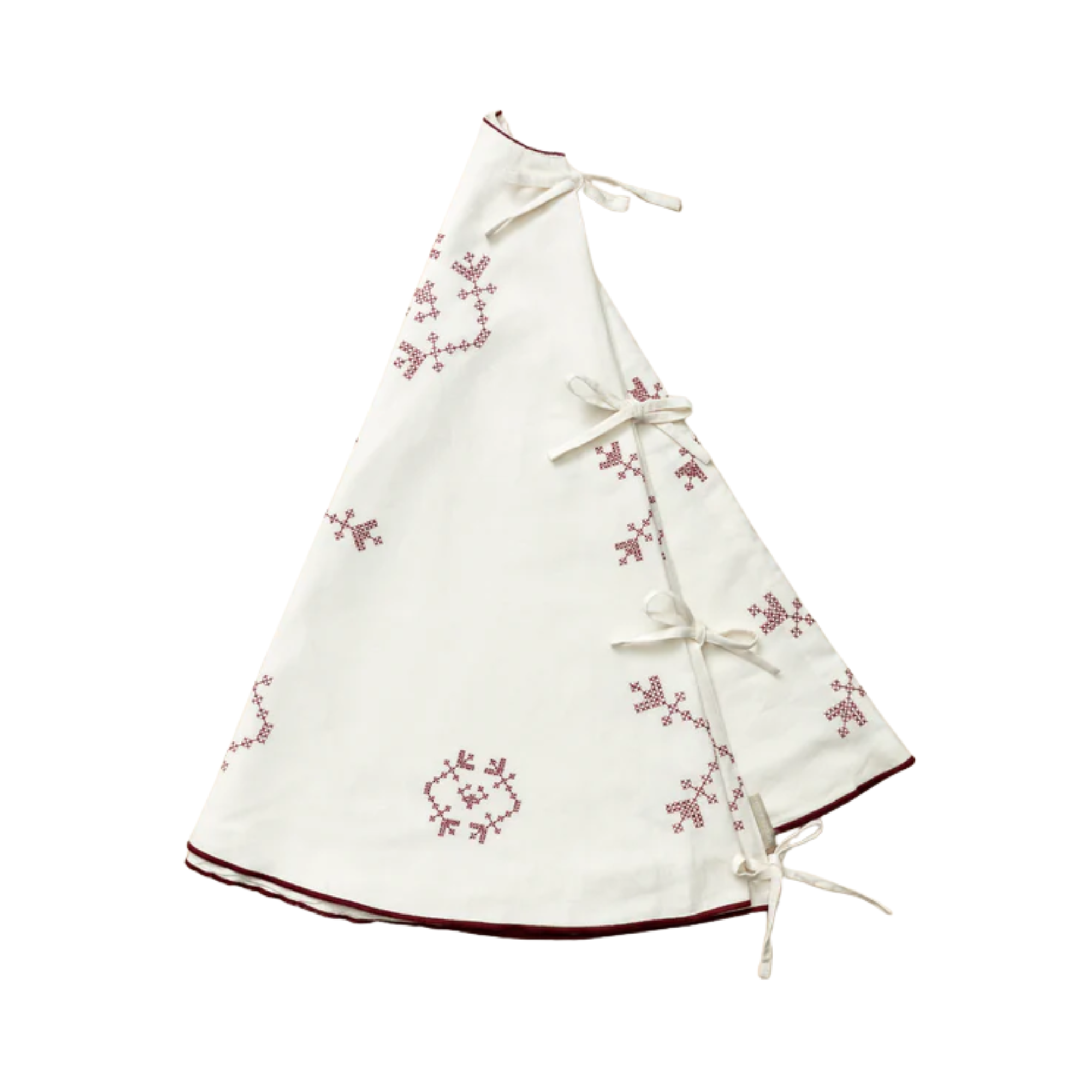 a white tree skirt with red detailing