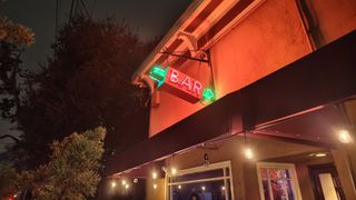 A photo of a bar sign at night shot by the Nothing Phone 3a