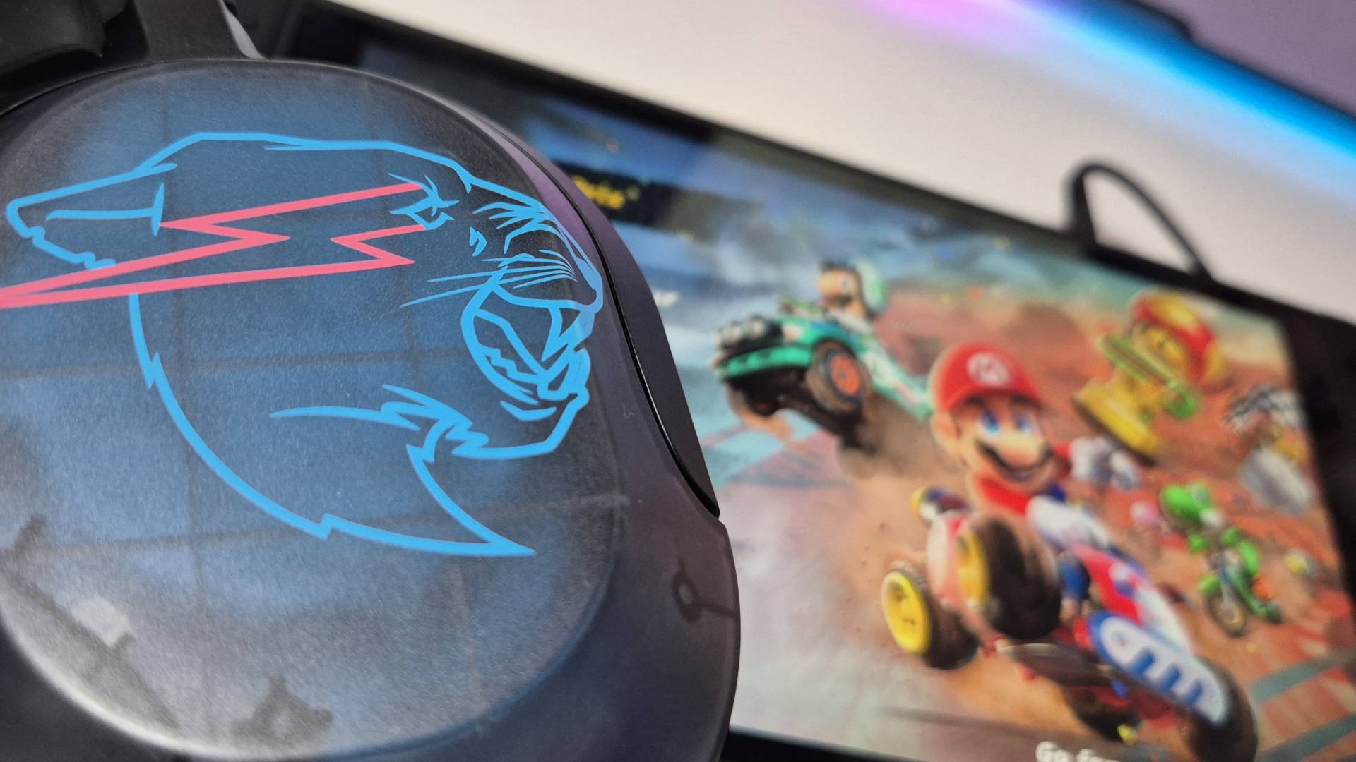 Photo by Rosalie Newcombe of the JLab Gaming x MrBeast Nightfall headset sitting on a Nintendo Switch 2.