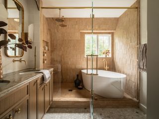 caramel brown bathroom with double shower and bathtub