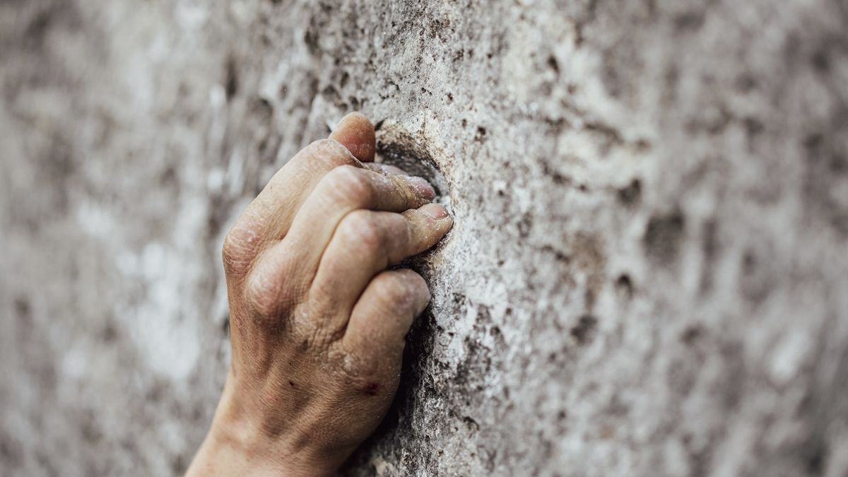 climber&#039;s hand on rock