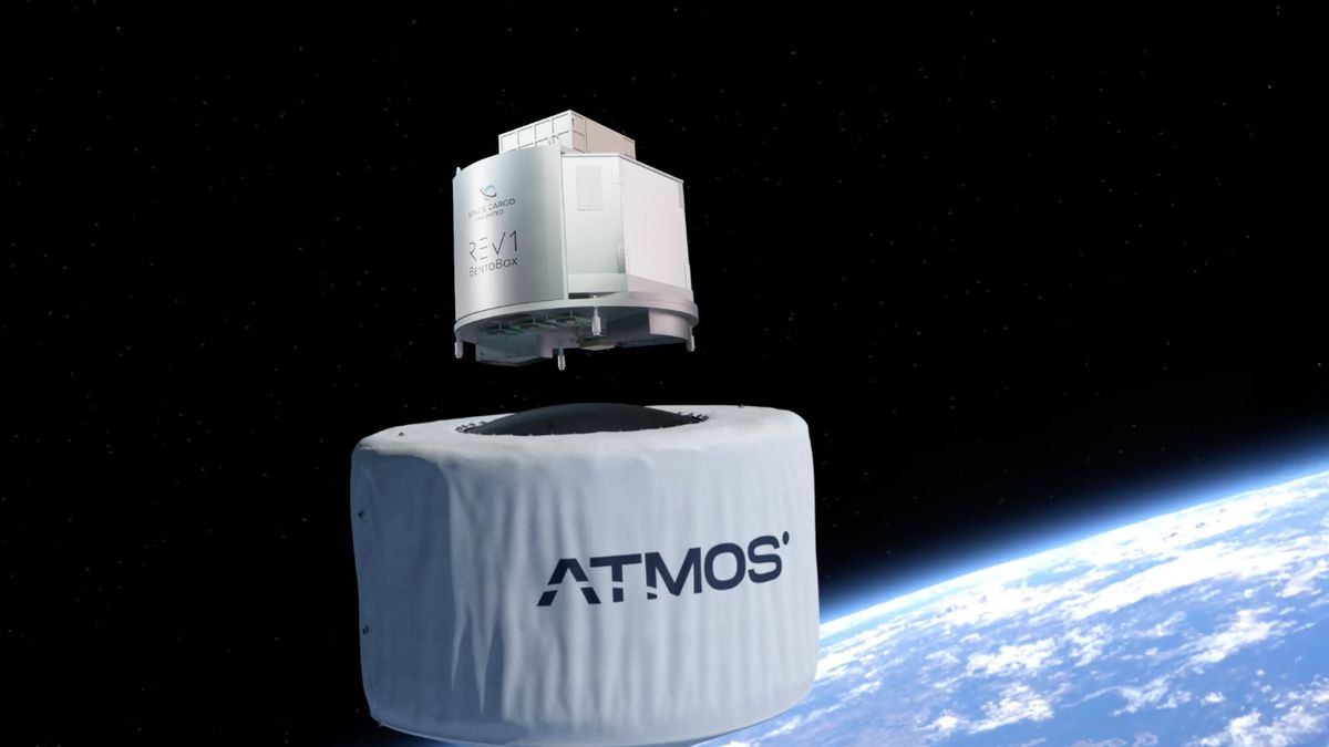 illustration of a silver boxy spacecraft and a cylindrical white spacecraft just below it, both in earth orbit