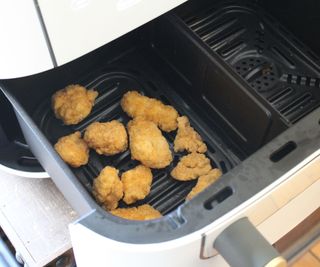 Cooking chicken bites in the Beautiful 9-Quart TriZone Air Fryer